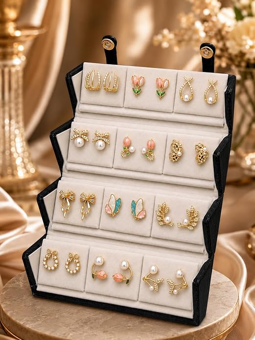 Gold Earrings Collection in Jewellery Box Gold earrings collection displayed in a jewellery box
